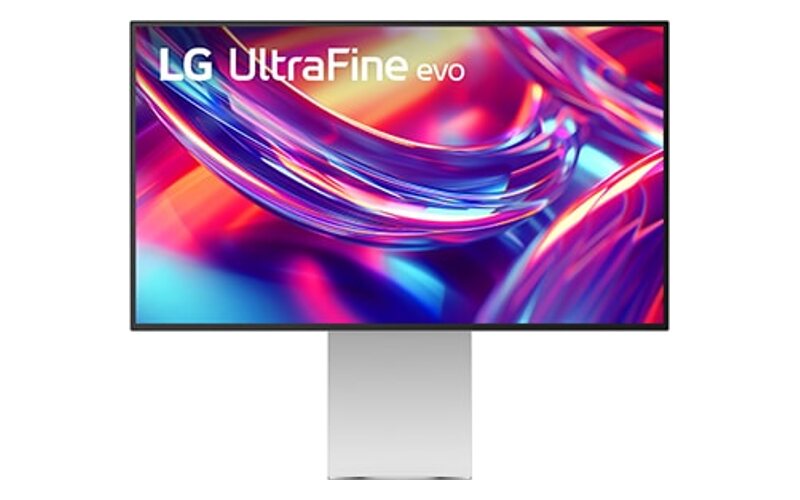 LG UltraFine evo 32U990A na širokém stříbrném stojanu, na displeji barevná světelná abstrakce